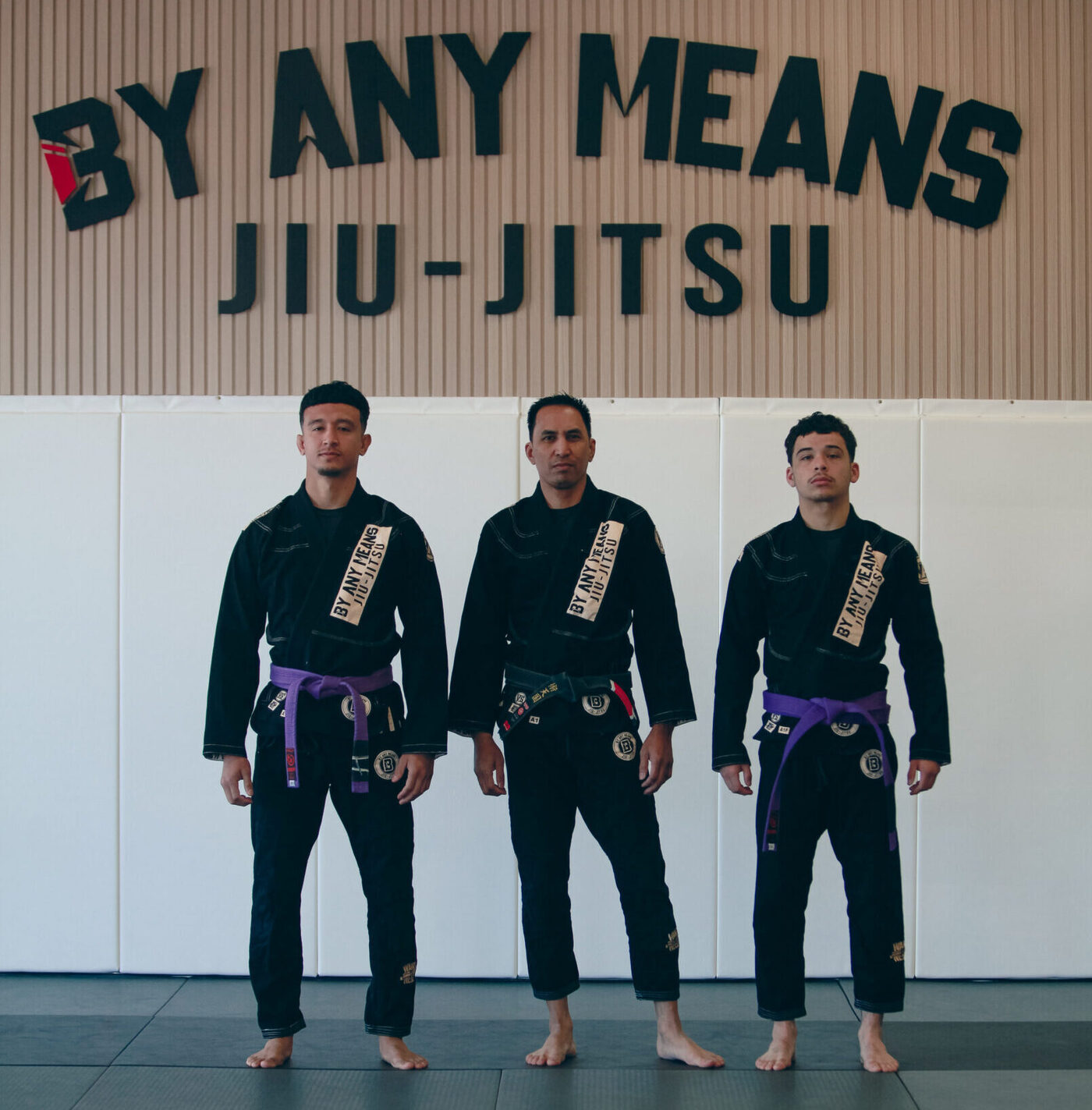 Instructors under the By Any Means sign